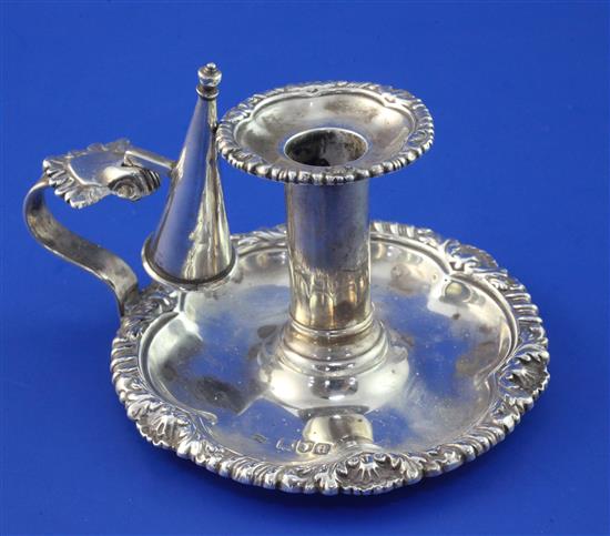 A late Victorian silver chamberstick and snuffer, 5 oz.